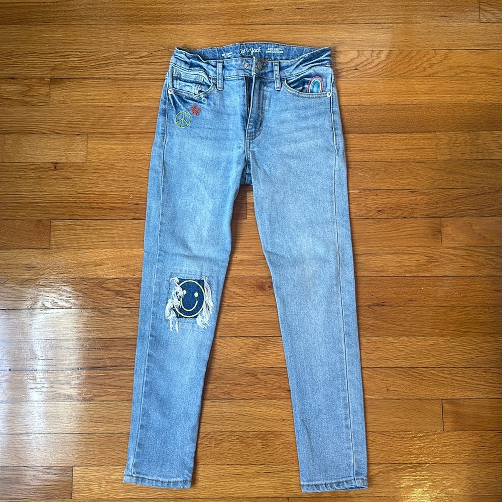 Girls’ Cat and Jack ripped smiley face jeans, size 10